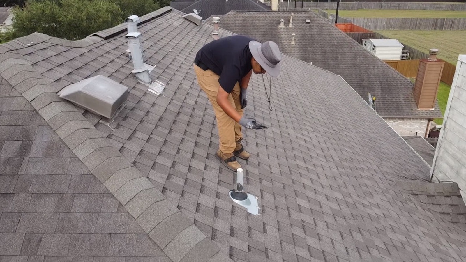 Bearmark technician inspecting a residential roof