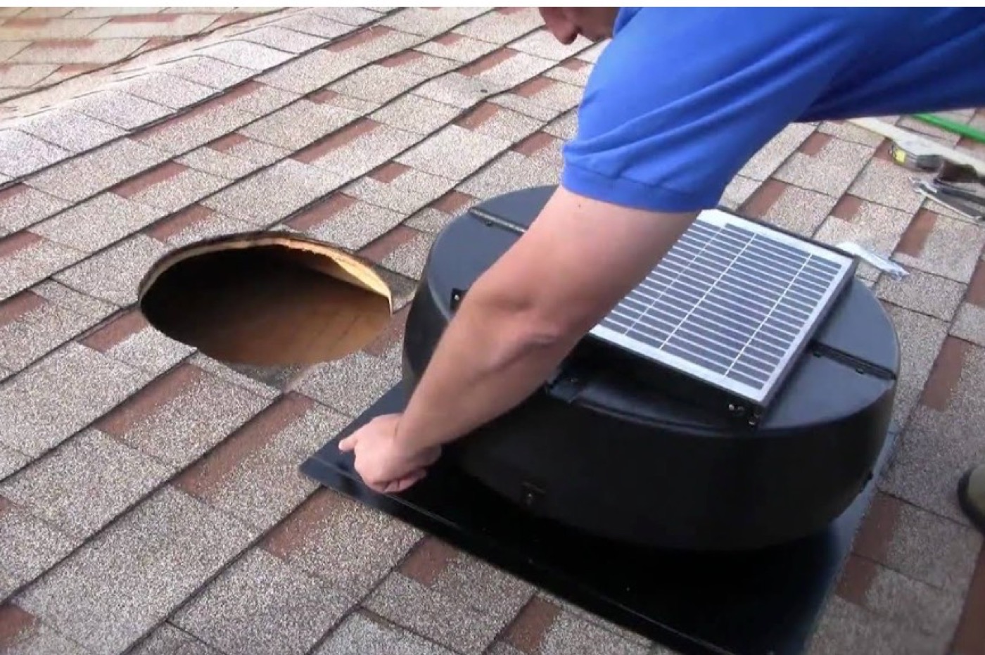 Solar-powered roof ventilation fan being installed as part of a Bearmark Home Performance Check